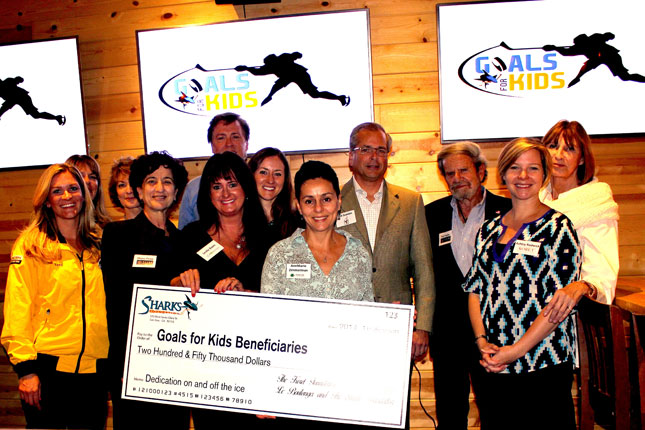 Shana Penn (Executive Director, Taube Philanthropies), Tad Taube (Chairman, Taube Philanthropies), Ashley Rodwick (Program Officer, Koret Foundation), and Tina Frank (Vice President and Chief Operating Officer, Koret Foundation) attend the award ceremony of Goals for Kids and present the beneficiaries with a check for $250,000.00. 
