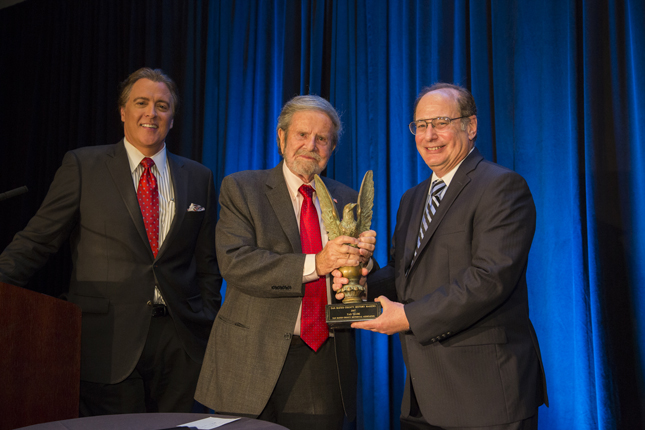 [L-R] The evening’s MC Dan Ashley with Tad Taube and Mitch Postel, SMCHA president, as Tad receives the 2017 History Maker award. Photo by Jim Kirkland.