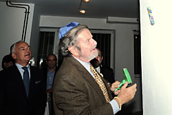 Tad Taube, Chairman of the Taube Foundation for Jewish Life & Culture, hammers the mezuzah.