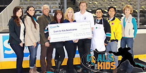 Goals for Kids gets a $250,000.00 check representing the 2014-15 season contributions; in attendance were Ken Marciano (third from left), representing Taube Philanthropies, and Gabriela Chavez-Lopez (second from left), representing the Koret Foundation. 