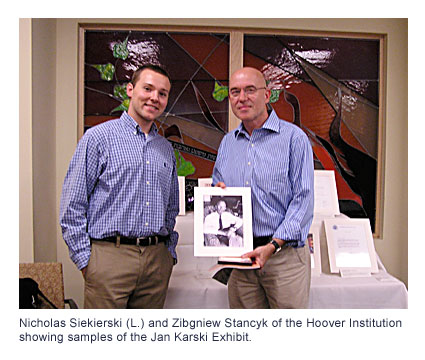 Nicholas Siekierski (L.) and Zibgniew Stancyk of the Hoover Institution showing samples of the Jan Karski Exhibit.